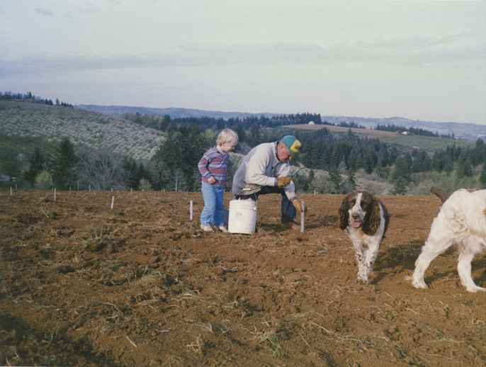 young Jim with dogs in future vineyard