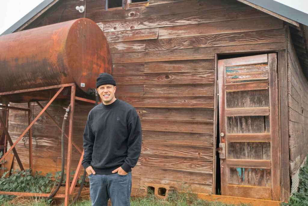 Jim in front of barn